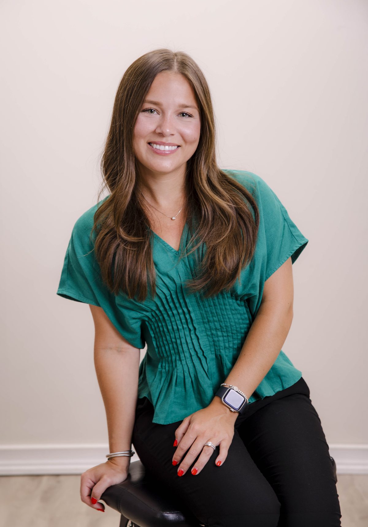 Alexa DiMeglio, Licensed Clinical Social Worker, seated and smiling